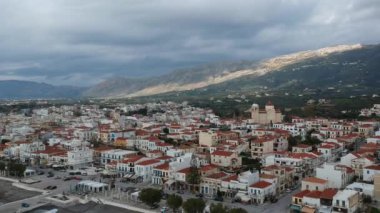 Aerial cityscape view of Neapolis town at sunset. Also named Vatika in Laconia, Greece. Neapoli is a famous coastal town built on the same site as the ancient Laconian city of Boeae