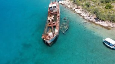Aerial view over rusty shipwreck of an old cargo boat at Peristera island near Alonissos, Sporades, Greece