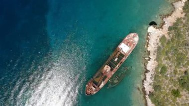 Aerial view over rusty shipwreck of an old cargo boat at Peristera island near Alonissos, Sporades, Greece