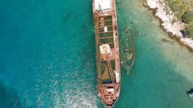 Aerial view over rusty shipwreck of an old cargo boat at Peristera island near Alonissos, Sporades, Greece