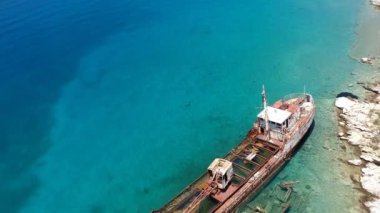 Aerial view over rusty shipwreck of an old cargo boat at Peristera island near Alonissos, Sporades, Greece