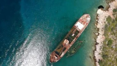 Aerial view over rusty shipwreck of an old cargo boat at Peristera island near Alonissos, Sporades, Greece