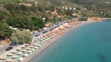 Aerial view over Santova coastal area in Messinia, Greece. Summer scenery with beautiful seaside bars and tourists in Santova near Kalamata city, Greece