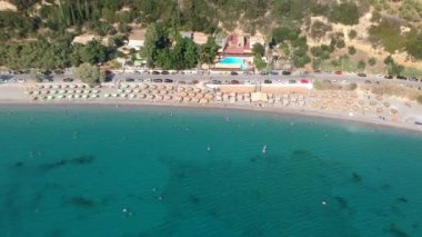 Aerial view over Santova coastal area in Messinia, Greece. Summer scenery with beautiful seaside bars and tourists in Santova near Kalamata city, Greece