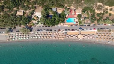 Aerial view over Santova coastal area in Messinia, Greece. Summer scenery with beautiful seaside bars and tourists in Santova near Kalamata city, Greece