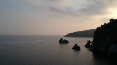 Amazing aerial view over the rocky scenery near Stafilos beach in southern Skopelos island at sunset in Sporades, Greece