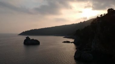 Amazing aerial view over the rocky scenery near Stafilos beach in southern Skopelos island at sunset in Sporades, Greece