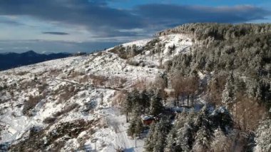 Aerial view of the snowy mountain Taygetus (also known as Taugetus or Taygetos) above Messenia unit in Peloponnese, Greece. Amazing natural scenery of the highest mountain in Peloponnese during winter