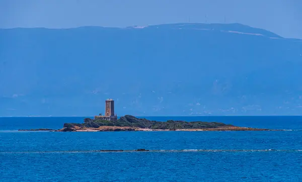 stock image Kafkalida Lighthouse located on the island of Kafkalida, in the Ionian sea, at the wester side of Peloponnese, not far from Killini port on the seaway to Zakynthos island.