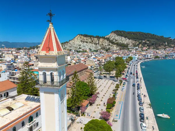 stock image ZAKYNTHOS, GREECE - JUNE 20 2024: Aerial panoramic view over Zakynthos city against a beautiful blue Summer sky. Zakynthos island, Ionian sea in western Greece