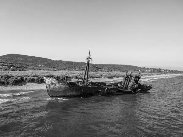 stock image Iconic aerial View of a Dramatic Shipwreck in Scenic Waters in Greece - Black and White edit