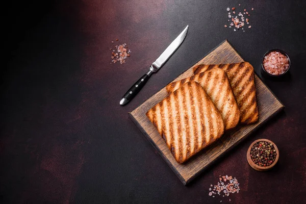 Stock image Tasty fresh crispy bread slices in the form of grilled toast for cooking delicious family breakfast