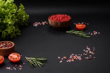 Delicious baked pork or chicken roll with mushrooms, spices and herbs inside on a dark concrete background