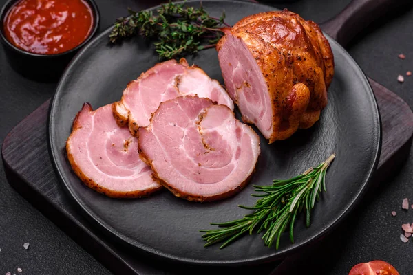 stock image Delicious fresh baked meat roll with spices and herbs on a dark concrete background