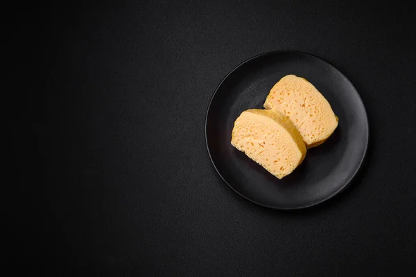 Delicious Porous Yellow Cheese Cut Large Pieces Ceramic Plate Dark — Stock Photo, Image