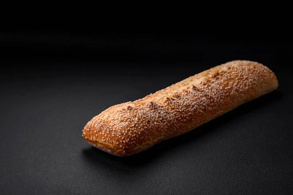 Crispy Wheat Flour Baguette Sesame Seeds Wooden Cutting Board Dark — Stock Photo, Image