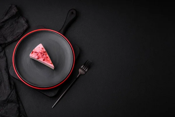 stock image Delicious sweet dessert cheesecake with raspberry and pistachio flavor on textured concrete background