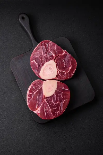 Fresh Raw Beef Steak Bone Ossobuco Salt Spices Herbs Dark — стокове фото