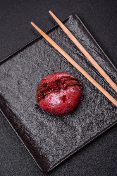 stock image Delicious sweet colorful mochi desserts or ice cream with rice dough and toppings on a dark concrete background