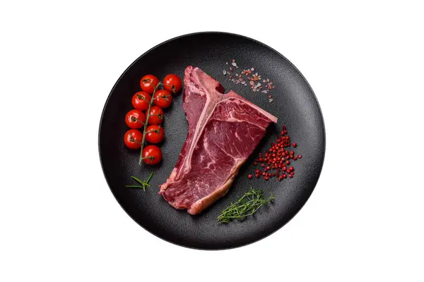 Raw Juicy Beef Bone Steak Salt Spices Herbs Textured Concrete — Stock Photo, Image