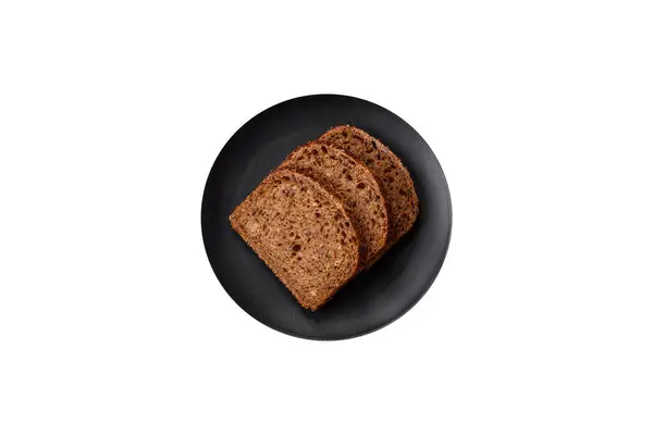 Вкусный Свежий Хрустящий Коричневый Хлеб Зерном Семенами Темном Бетонном Фоне — стоковое фото
