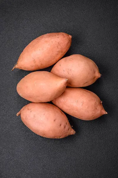 Fresh Large Pink Sweet Potato Tubers Tomatoes Spices Dark Background — Stock Photo, Image