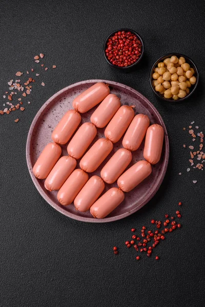 Delicious fresh vegetarian sausage or sausage made from vegetable protein tofu or seitan legumes, lean wheat with salt and spices on texture background