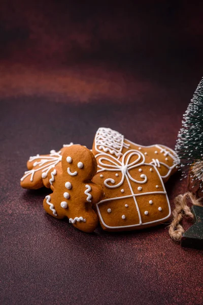 Beautiful delicious sweet winter Christmas gingerbread cookies on a bronze textured background. Preparing for a family holiday
