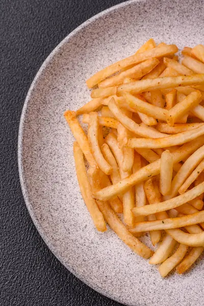 Delicious Crispy Golden Fries Salt Spices Dark Concrete Background — Stock Photo, Image
