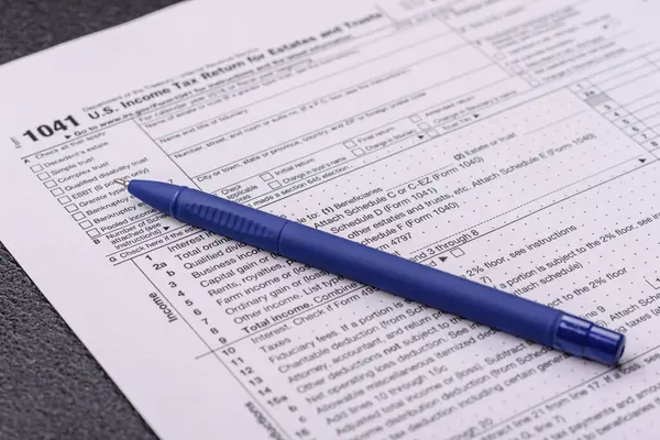 stock image Fill out US tax form 1041 for verification and refund. Tax reporting of US citizens