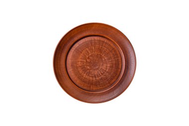 Empty ceramic round plate on dark textured concrete background. Cutlery, preparation for dinner