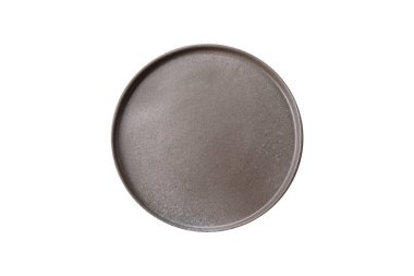 Empty ceramic round plate on dark textured concrete background. Cutlery, preparation for dinner