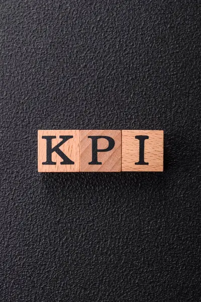 Stock image Inscription KPI Key Performance Indicator with wooden cubes, conceptual background with copy space for business issues