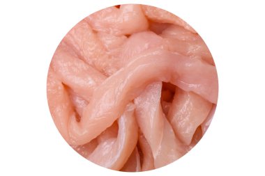 Raw chicken fillet cut into strips with spices and herbs on a white background