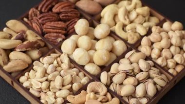 Çeşitli fıstıklı kutu, kaju, macadamia, fıstık, sedir, ceviz, ceviz, Brezilya cevizi, koyu dokulu fındık.