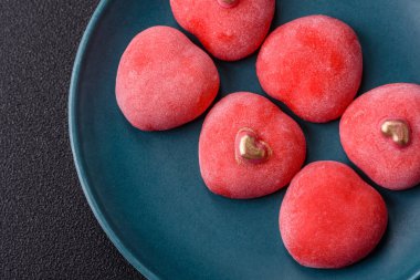 Delicious sweet mochi in the shape of red hearts for the holiday of Valentine's Day clipart