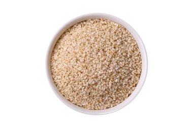 Bir kasede beyaz susam tohumu, vejetaryen ya da vejetaryen yemeği yapmak için bir malzeme. Lezzetli ve sağlıklı yemekler.