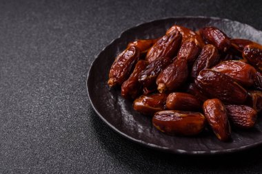 Kurutulmuş tropikal tarih meyvesi taze organik diyet gıdaları için bir malzeme olarak kullanılır. Vegan, vejetaryen yemeği