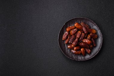 Kurutulmuş tropikal tarih meyvesi taze organik diyet gıdaları için bir malzeme olarak kullanılır. Vegan, vejetaryen yemeği