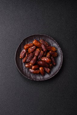 Kurutulmuş tropikal tarih meyvesi taze organik diyet gıdaları için bir malzeme olarak kullanılır. Vegan, vejetaryen yemeği