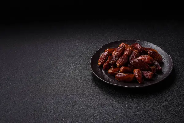 Kurutulmuş tropikal tarih meyvesi taze organik diyet gıdaları için bir malzeme olarak kullanılır. Vegan, vejetaryen yemeği