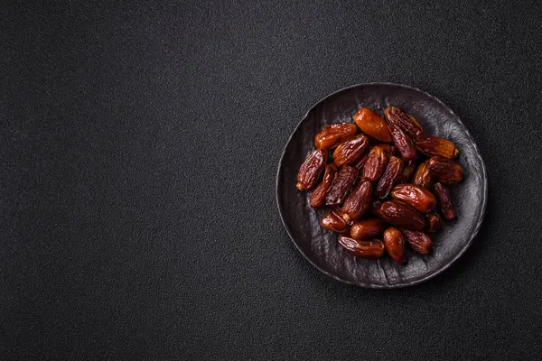 Kurutulmuş tropikal tarih meyvesi taze organik diyet gıdaları için bir malzeme olarak kullanılır. Vegan, vejetaryen yemeği