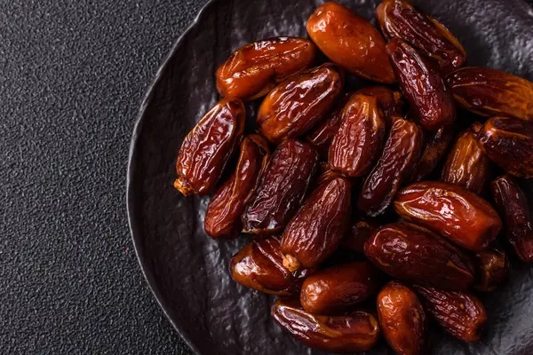 Kurutulmuş tropikal tarih meyvesi taze organik diyet gıdaları için bir malzeme olarak kullanılır. Vegan, vejetaryen yemeği