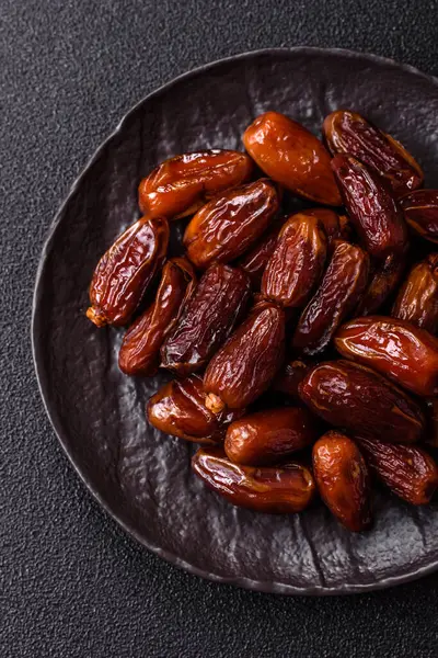 Kurutulmuş tropikal tarih meyvesi taze organik diyet gıdaları için bir malzeme olarak kullanılır. Vegan, vejetaryen yemeği