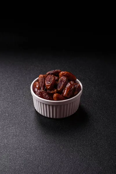 Kurutulmuş tropikal tarih meyvesi taze organik diyet gıdaları için bir malzeme olarak kullanılır. Vegan, vejetaryen yemeği