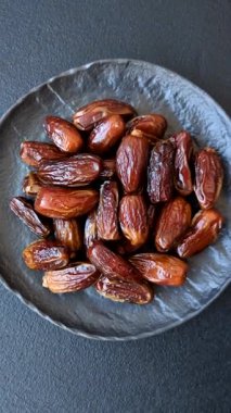 Kurutulmuş tropikal tarih meyvesi taze organik diyet gıdaları için bir malzeme olarak kullanılır. Vegan, vejetaryen yemeği