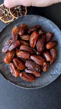 Kurutulmuş tropikal tarih meyvesi taze organik diyet gıdaları için bir malzeme olarak kullanılır. Vegan, vejetaryen yemeği