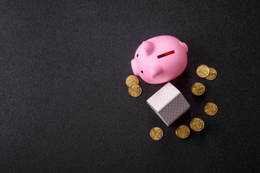 Piggy Bank madeni bir kavramsal arka plan olarak madeni paralar, iş yapmak, para biriktirmek, vergi ödemek ve borçları ödemek