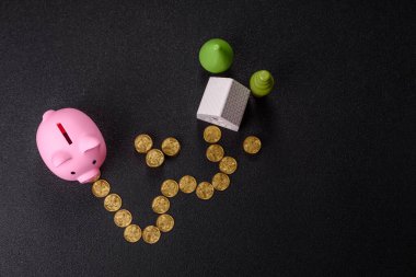 Piggy Bank madeni bir kavramsal arka plan olarak madeni paralar, iş yapmak, para biriktirmek, vergi ödemek ve borçları ödemek