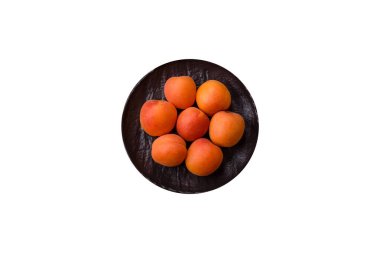 Taze olgun meyve kayısıları kırmızı sarı renktedir. Tasarımınız için arka plan olarak kayısılar